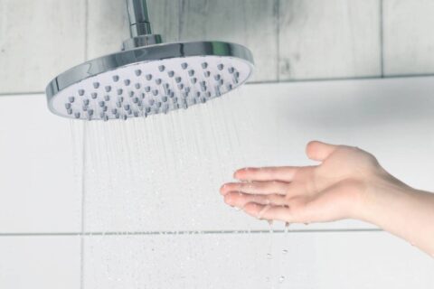 Person checking shower wondering why won't the water heat up